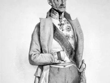 Polní podmaršálek (od 17. 10. 1848 polní maršálek) Alfred kníže zu Windischgrätz (1787– 1862) s Řádem zlatého rouna, velkostuhou a hvězdou Vojenského řádu Marie Terezie, hvězdou Královského uherského řádu sv. Štěpána, služebním křížem za roky odsloužené v armádě a zlatým dělovým křížem z napoleonských válek. Byl dále nositelem ruského Imperátorského řádu sv. Alexandra Něvského, ruského Imperátorského řádu sv. Vladimíra, ruského Imperátorského řádu sv. Jiří, pruského Řádu červené orlice, hannoverského Řádu Guelfů, savojského řádu sv. Mauricia a sv. Lazara a bavorského Řádu sv. Huberta. Litografie Josefa Kriehubera z roku 1848.